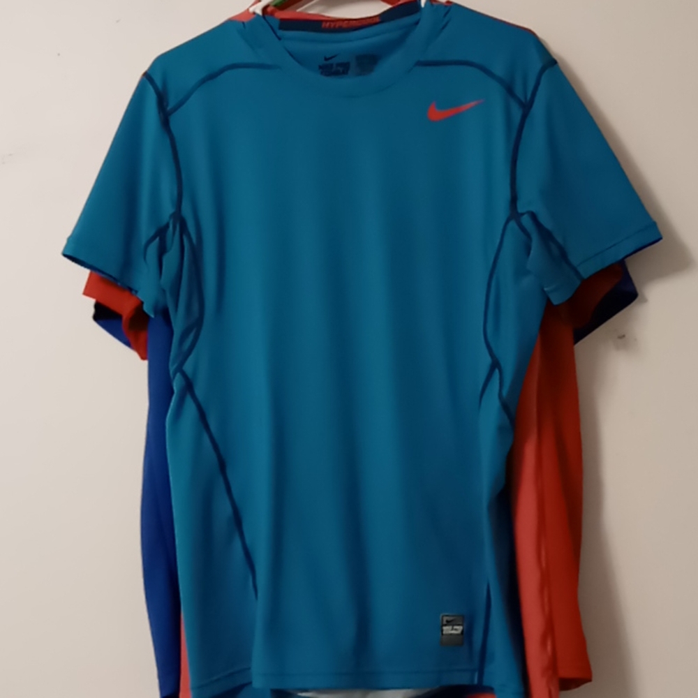 Bundle of four men's workout shirts